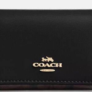 Coach Black Leather Wallet with Gold Accents